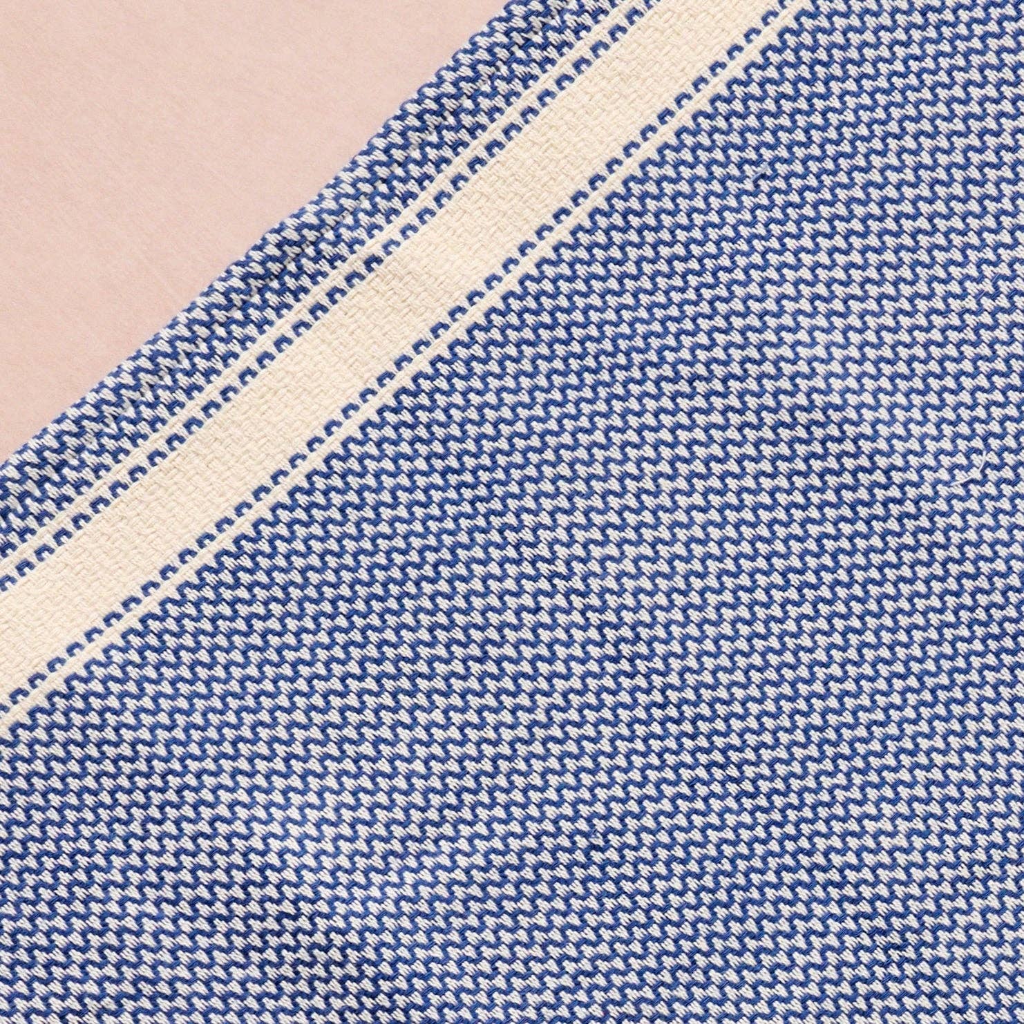 Brighten your kitchen with a pop of color and timeless charm. This striped woven tea towel blends function with simple elegance, featuring a refreshing blue and white base accented by three bold tan stripes at each end. Crafted from 100% cotton, it’s soft, absorbent and ready to tackle daily tasks - from drying dishes to lining a breadbasket. A convenient cotton loop in the corner makes it easy to hang and display. Whether you’re cooking up memories or cleaning up spills, this towel adds a cheerful, artisan