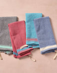 Brighten your kitchen with a pop of color and timeless charm. This striped woven tea towel blends function with simple elegance, featuring a refreshing blue and white base accented by three bold tan stripes at each end. Crafted from 100% cotton, it’s soft, absorbent and ready to tackle daily tasks - from drying dishes to lining a breadbasket. A convenient cotton loop in the corner makes it easy to hang and display. Whether you’re cooking up memories or cleaning up spills, this towel adds a cheerful, artisan