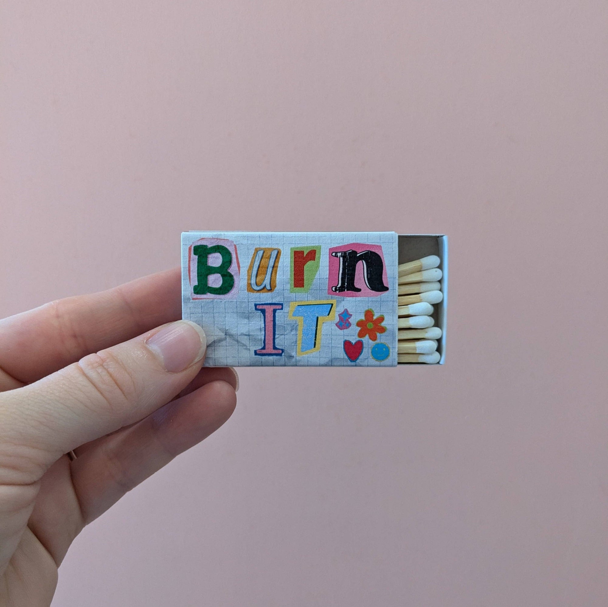 For when “let it go” just doesn’t cut it: BURN IT. This matchbox is your tiny, colorful hype squad for setting fire (literally or metaphorically) to whatever’s holding you back. Old love letters? Burn ‘em. Bad vibes? Torch ‘em. That candle you panic-bought during your “self-care” era? Light it up, baby. With a rebellious cut-and-paste design and zero patience for nonsense, this matchbox says what you’re thinking: some things are better in flames.