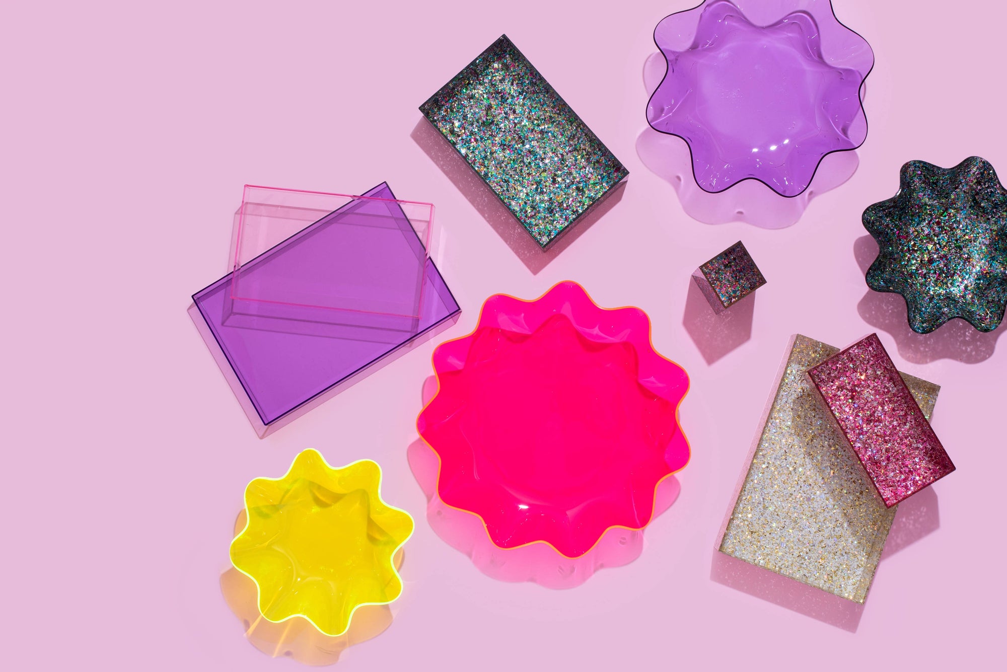 Add a playful pop to any space with this medium wavy acrylic bowl in vibrant purple! Great for corralling small items or adding color to a shelf, this bowl is as functional as it is fun. Mix and match with other sizes and colors for a bold, layered look that stands out.