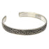 Silver open cuff bracelet with a rope pattern band on a white background