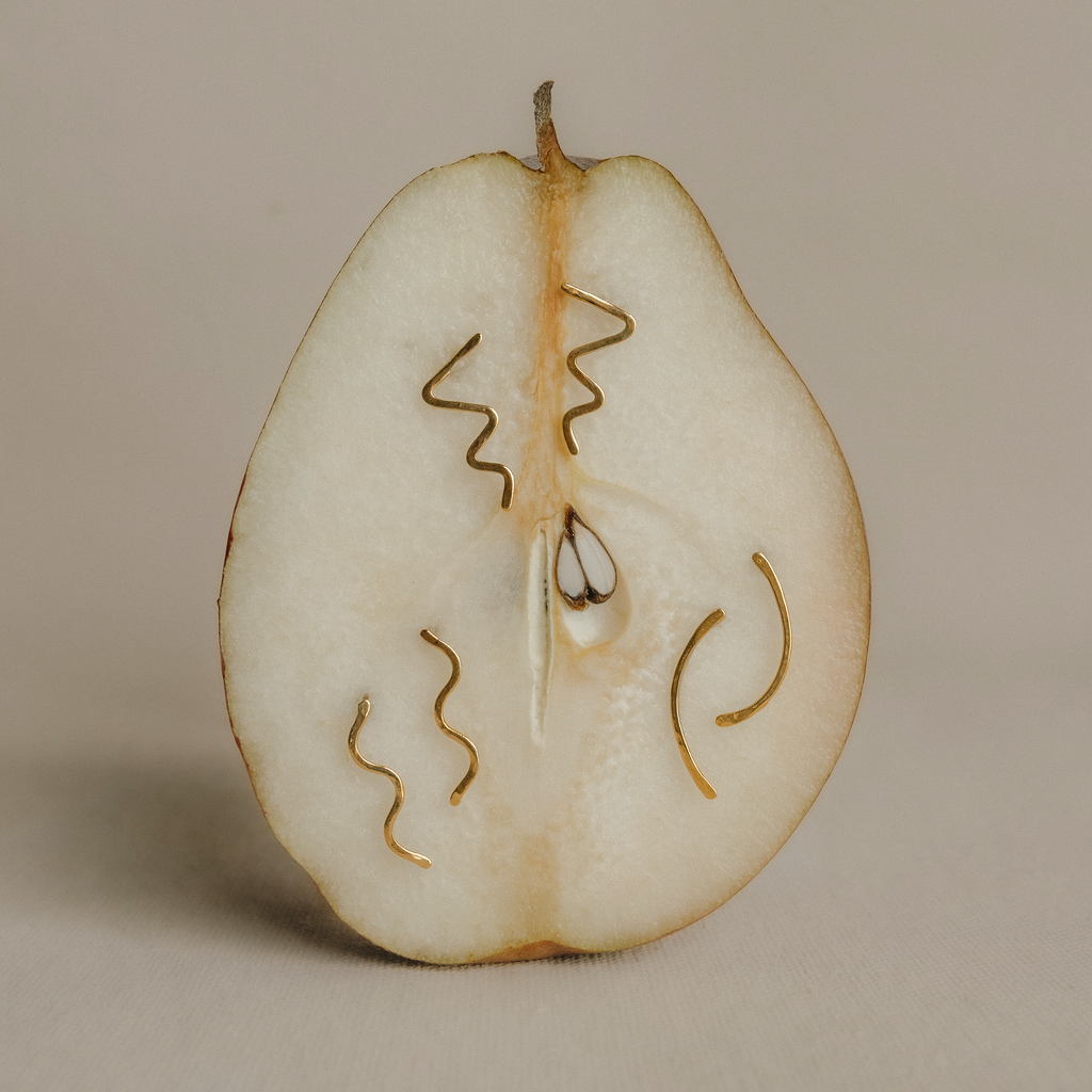 Pairs of gold-colored millicent stud earrings with a hammered texture
