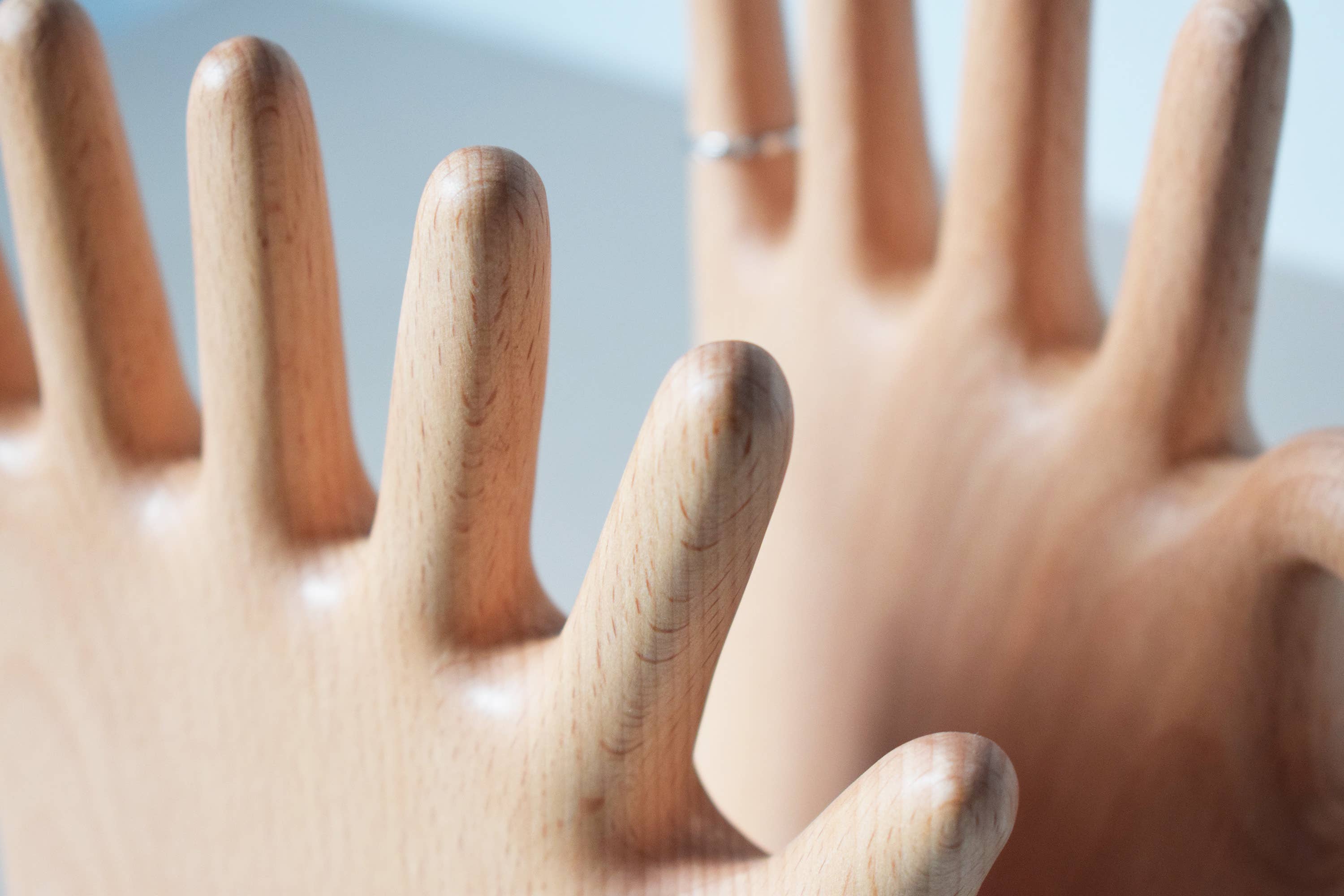 Keep your rings, necklaces, and bracelets organized with a fun twist. This beech wood jewelry display features a regular hand with one extra finger, giving you six spots to hang all your favorite pieces. Perfect for adding a whimsical and functional accent to your dresser or vanity.