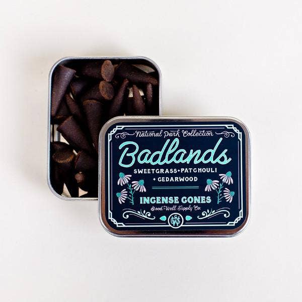 Tin of Badlands incense cones with decorative label on a white background