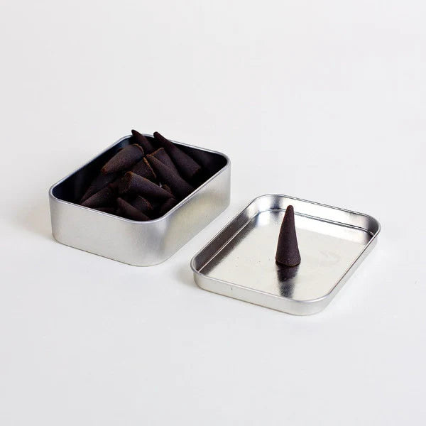 Indulge in the rich aromas of Big Bend National Park with Good &amp; Well Supply Co's hand-dipped incense cones. Encased in a robust aluminum tin, these cones are thoughtfully designed, with the lid serving as a convenient burning surface. With notes of charred wood, amber, smoky embers, and spice, you'll be transported to an evening camping in Big Bend.&nbsp;