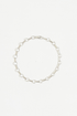 Sterling silver bar and ring chain bracelet laid in a circle on a white background