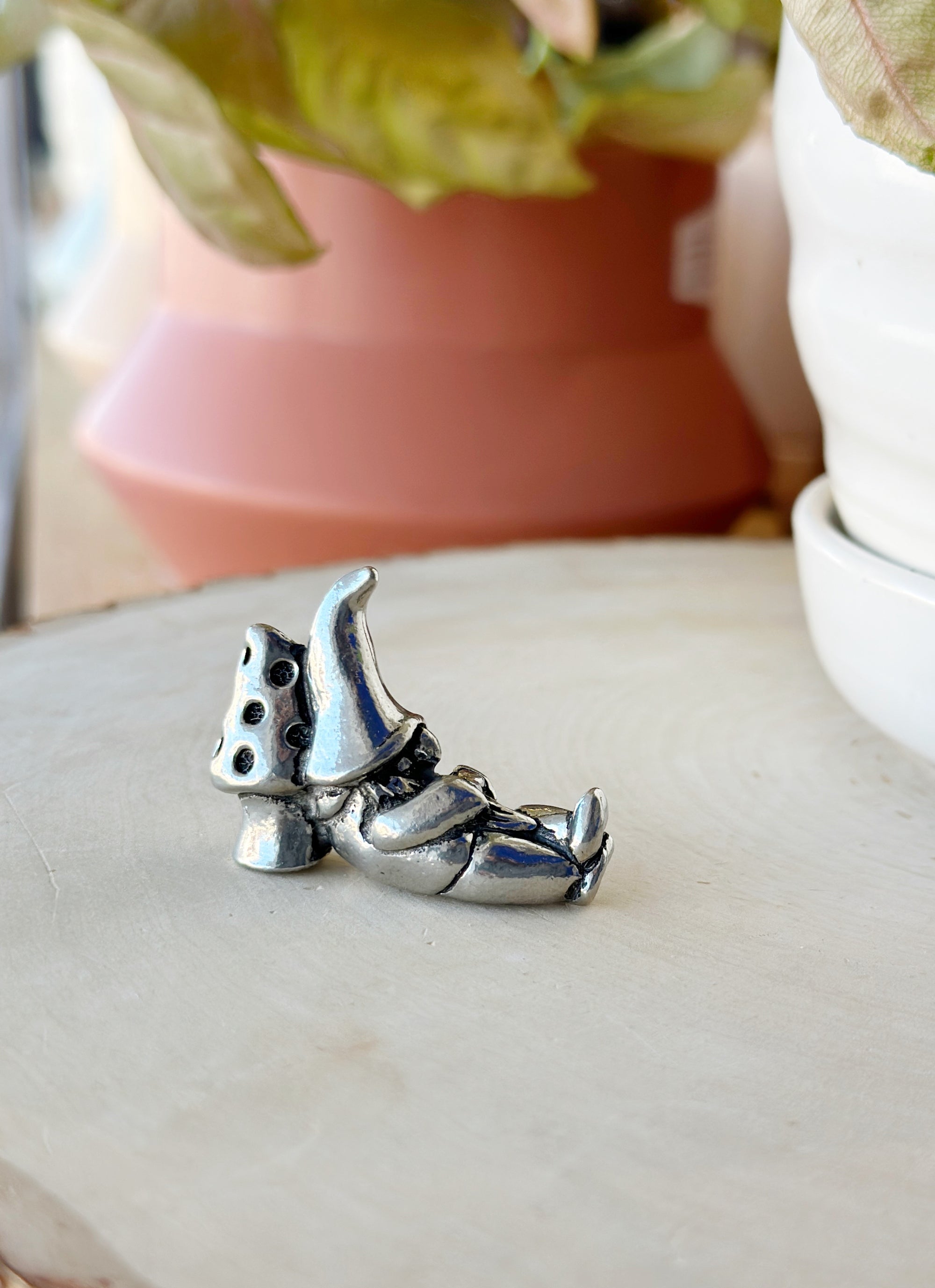 Whimsical 2 in pewter gnome, handcrafted in Canada! With 3 styles—lantern, stick, or mushroom nap—he’s perfect for adding character to your garden or shelf.