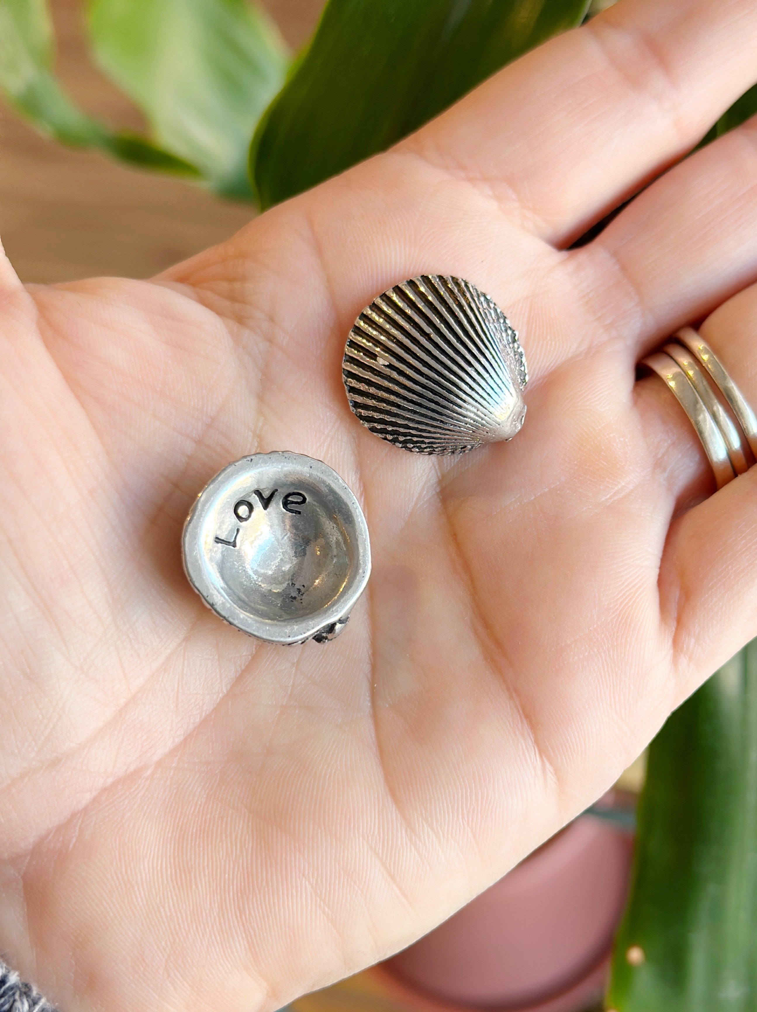 A meaningful keepsake, this pewter shell reveals "love" on the back. Great for collections, gifts, or sharing positivity. Handmade in Canada.