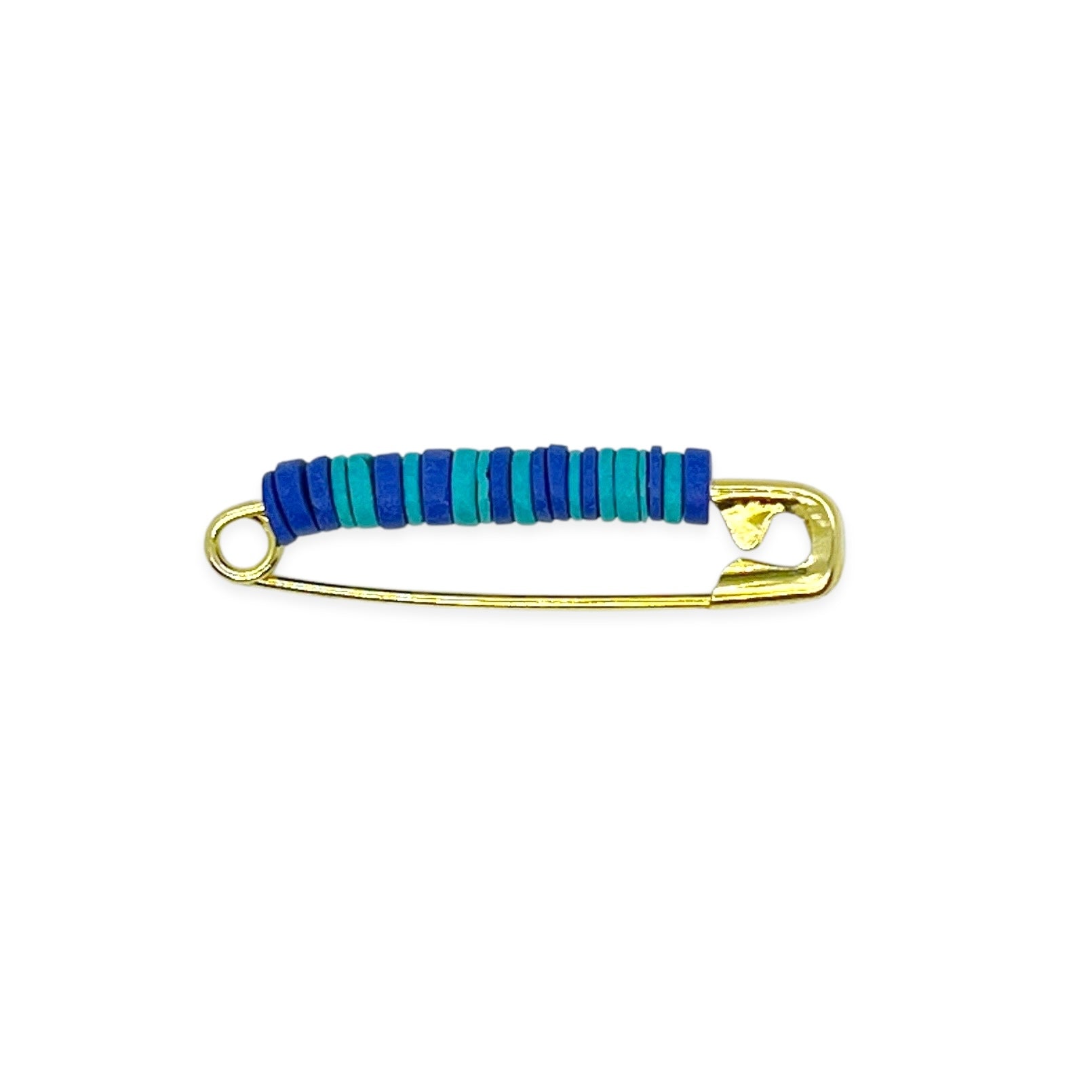 Inspired by the iconic pins from childhood brownie and scout days, our beaded safety pin shoe pin blends solid brass durability with colorful Greek ceramic beads for a fresh take on a classic. Each pin is crafted to add a playful, nostalgic touch to your favorite shoes, bags, or gear — a small symbol of friendship and adventure.