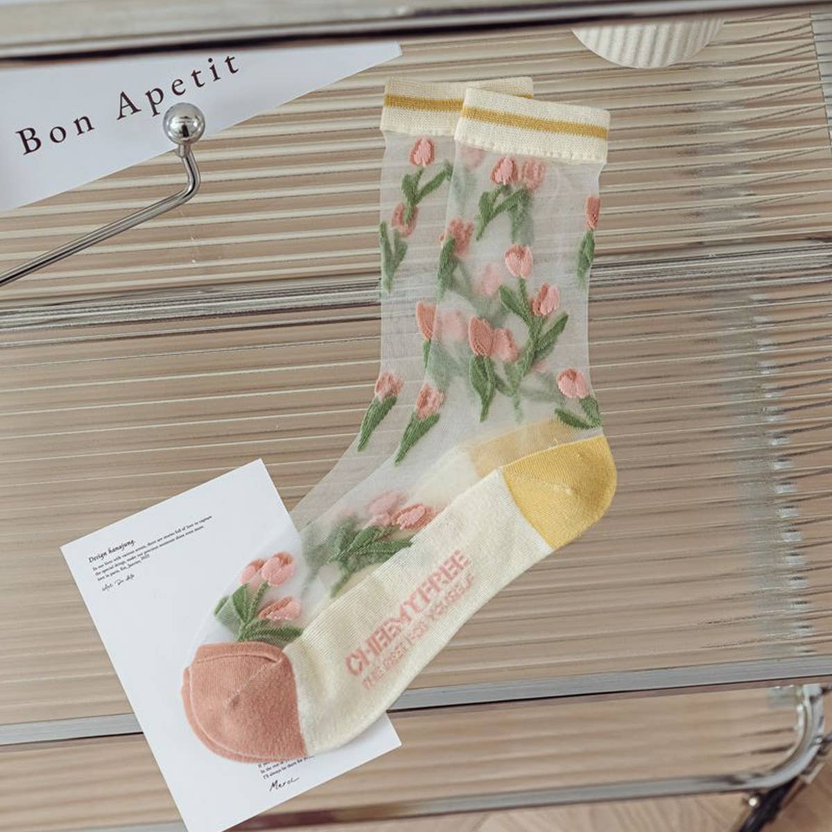 Step up your sock game with these fun, transparent sheer socks. Each pair features playful designs that add a subtle pop of personality to any outfit. Lightweight and breezy, they’re perfect for layering with sneakers, heels, or flats for a whimsical, stylish touch.