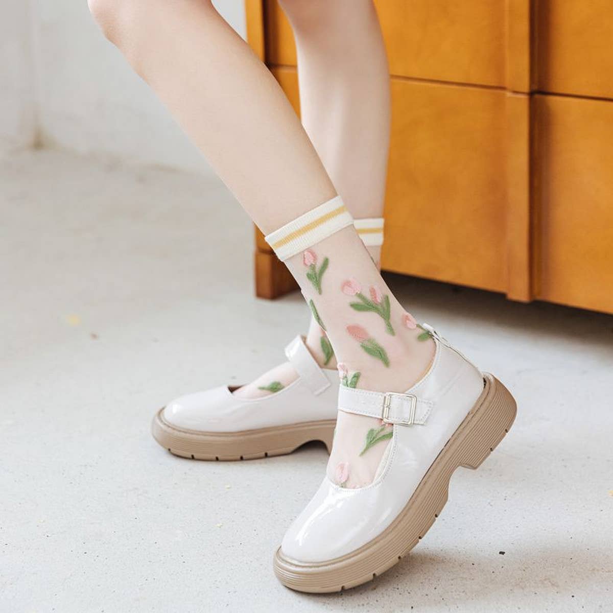 Step up your sock game with these fun, transparent sheer socks. Each pair features playful designs that add a subtle pop of personality to any outfit. Lightweight and breezy, they’re perfect for layering with sneakers, heels, or flats for a whimsical, stylish touch.