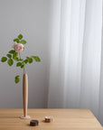 Crafted from fine maple wood and delicately polished, this single flower vase embodies the elegance of Eastern Zen aesthetics. Minimal yet refined, it adds a serene touch to any space—perfect for home décor or as a thoughtful housewarming gift.