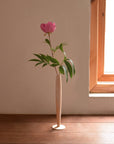Crafted from fine maple wood and delicately polished, this single flower vase embodies the elegance of Eastern Zen aesthetics. Minimal yet refined, it adds a serene touch to any space—perfect for home décor or as a thoughtful housewarming gift.