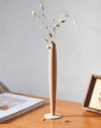 Crafted from fine maple wood and delicately polished, this single flower vase embodies the elegance of Eastern Zen aesthetics. Minimal yet refined, it adds a serene touch to any space—perfect for home décor or as a thoughtful housewarming gift.
