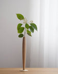 Crafted from fine maple wood and delicately polished, this single flower vase embodies the elegance of Eastern Zen aesthetics. Minimal yet refined, it adds a serene touch to any space—perfect for home décor or as a thoughtful housewarming gift.