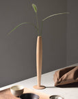 Crafted from fine maple wood and delicately polished, this single flower vase embodies the elegance of Eastern Zen aesthetics. Minimal yet refined, it adds a serene touch to any space—perfect for home décor or as a thoughtful housewarming gift.