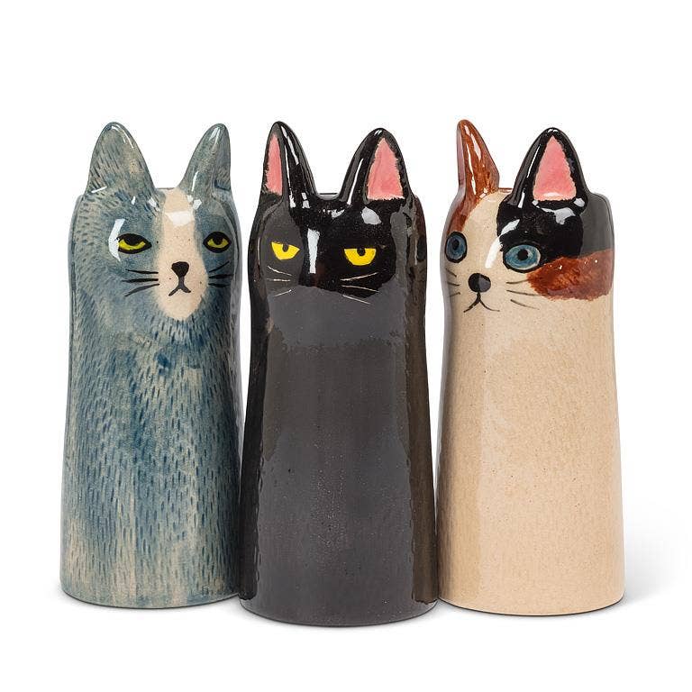 Add the purr-fect touch to your decor with this sleek Cat Vase. Featuring a modern silhouette, this striking feline is finished in a glossy glaze, accentuated by piercing eyes and delicate ears. Whether displayed alone or as part of a collection, these cat vases bring a touch of cattitude to any space.