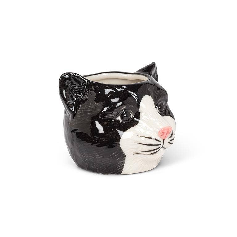 This adorable Small Black Cat Head Planter is the perfect complement to any cat lover's favorite cactus, succulent or flowers. Crafted out of ceramic, the cartoon-like shape of this cat head planter is sure to add a touch of fun and whimsy anywhere.