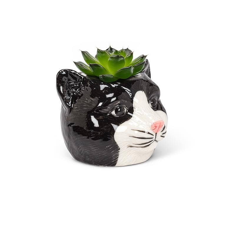 This adorable Small Black Cat Head Planter is the perfect complement to any cat lover's favorite cactus, succulent or flowers. Crafted out of ceramic, the cartoon-like shape of this cat head planter is sure to add a touch of fun and whimsy anywhere.