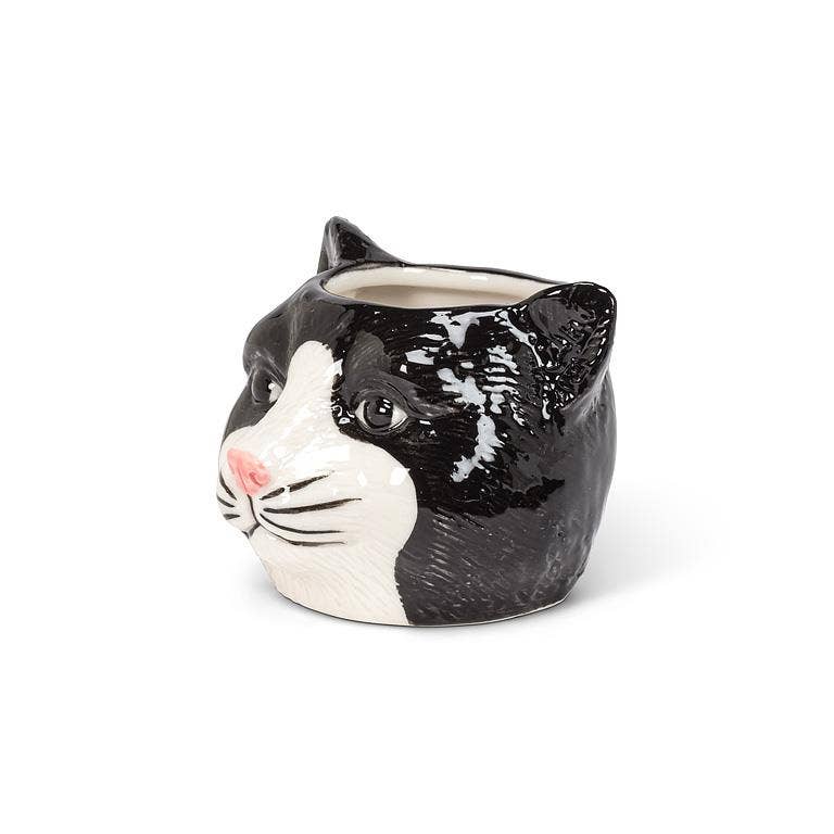 This adorable Small Black Cat Head Planter is the perfect complement to any cat lover's favorite cactus, succulent or flowers. Crafted out of ceramic, the cartoon-like shape of this cat head planter is sure to add a touch of fun and whimsy anywhere.