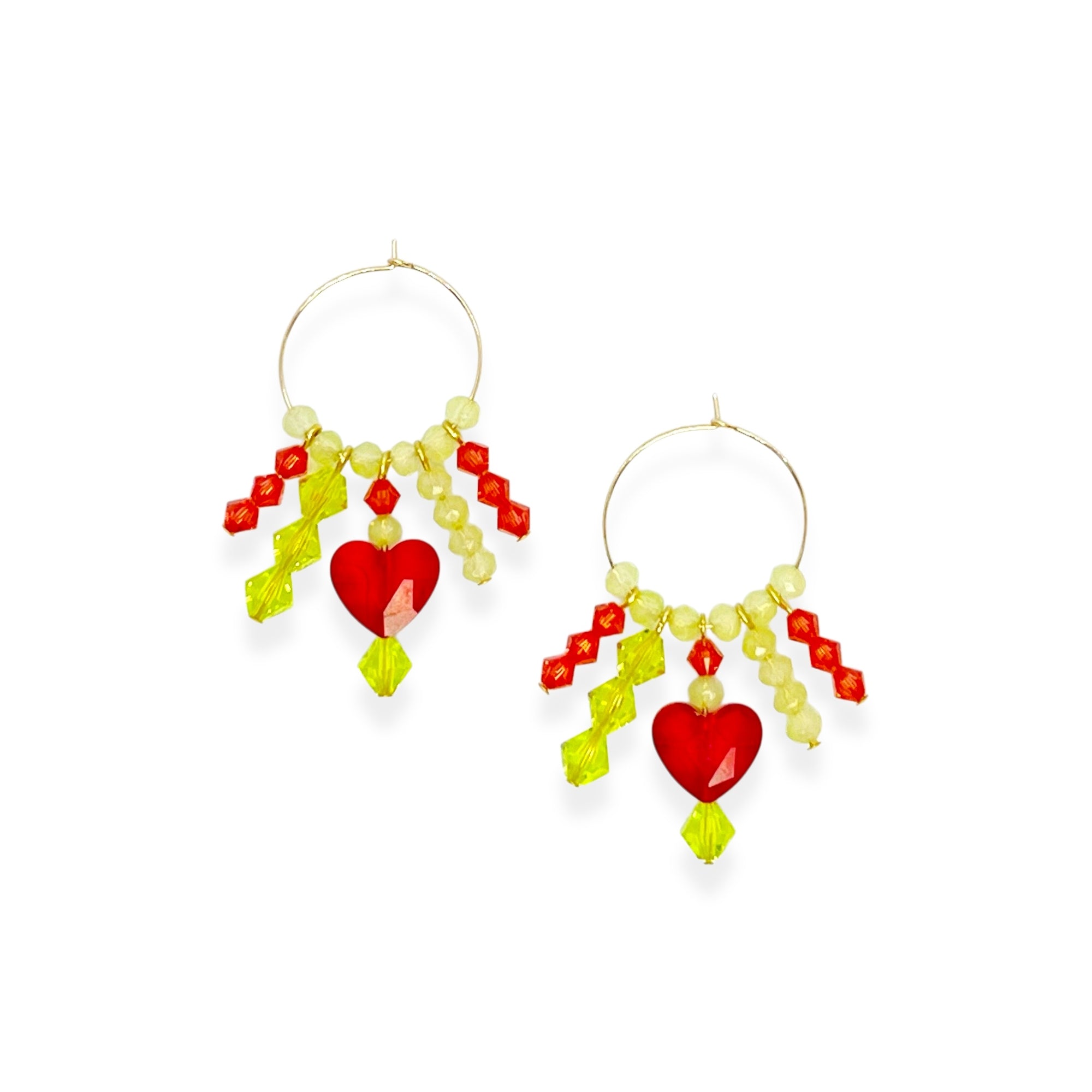 Joyful, flirty, and full of energy—these Small Spark Hoops are a burst of personality. A radiant heart-shaped crystal takes center stage, framed by watermelon and chartreuse tones that feel like summer bottled up. A scattering of dangling crystals adds playful movement, making these hoops perfect for anyone who loves to stand out and shine.