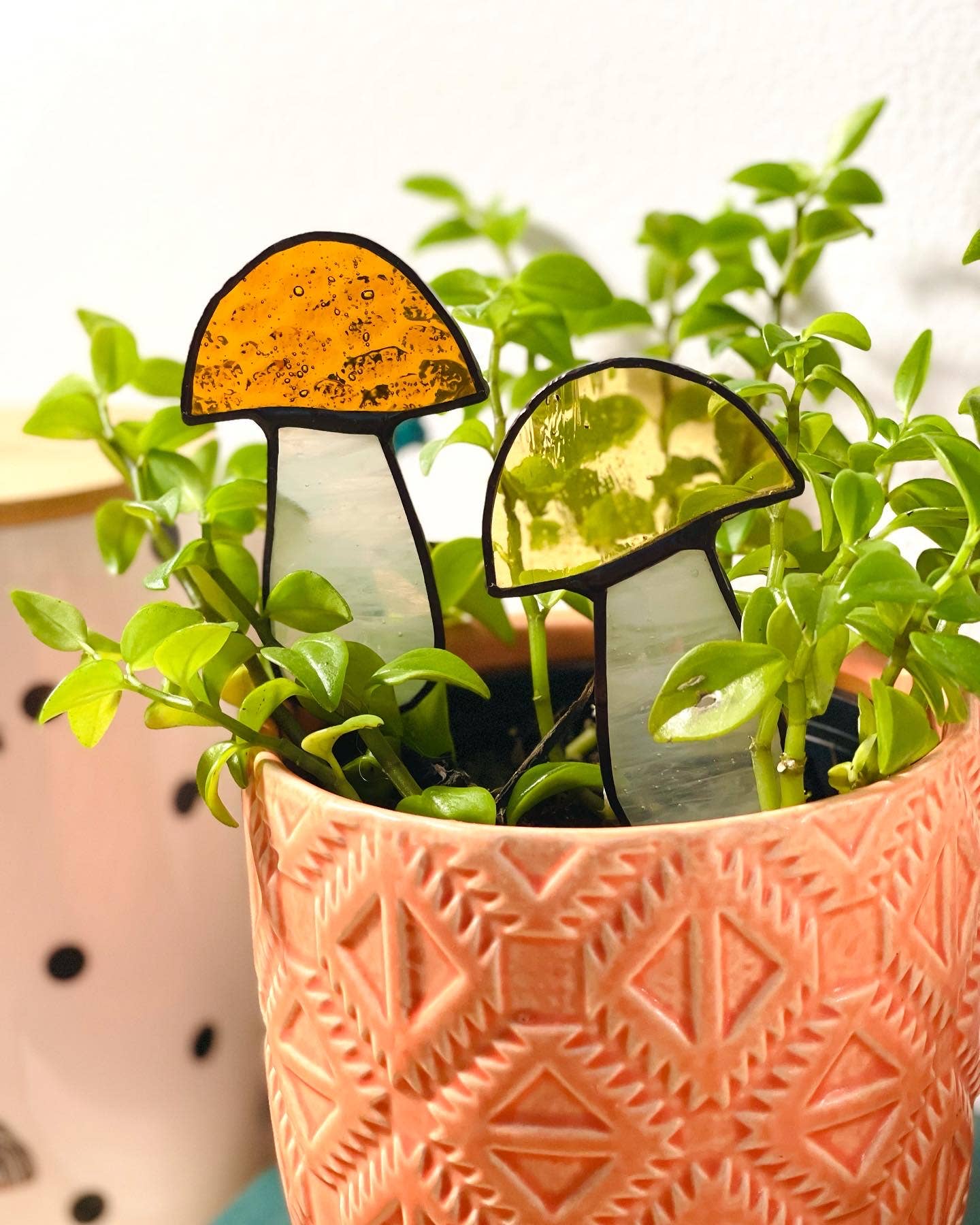 Handcrafted amber stained glass mushroom adds charm to plants or gardens. Weatherproof and pet-safe. Perfect for unique home decor and garden gifts.