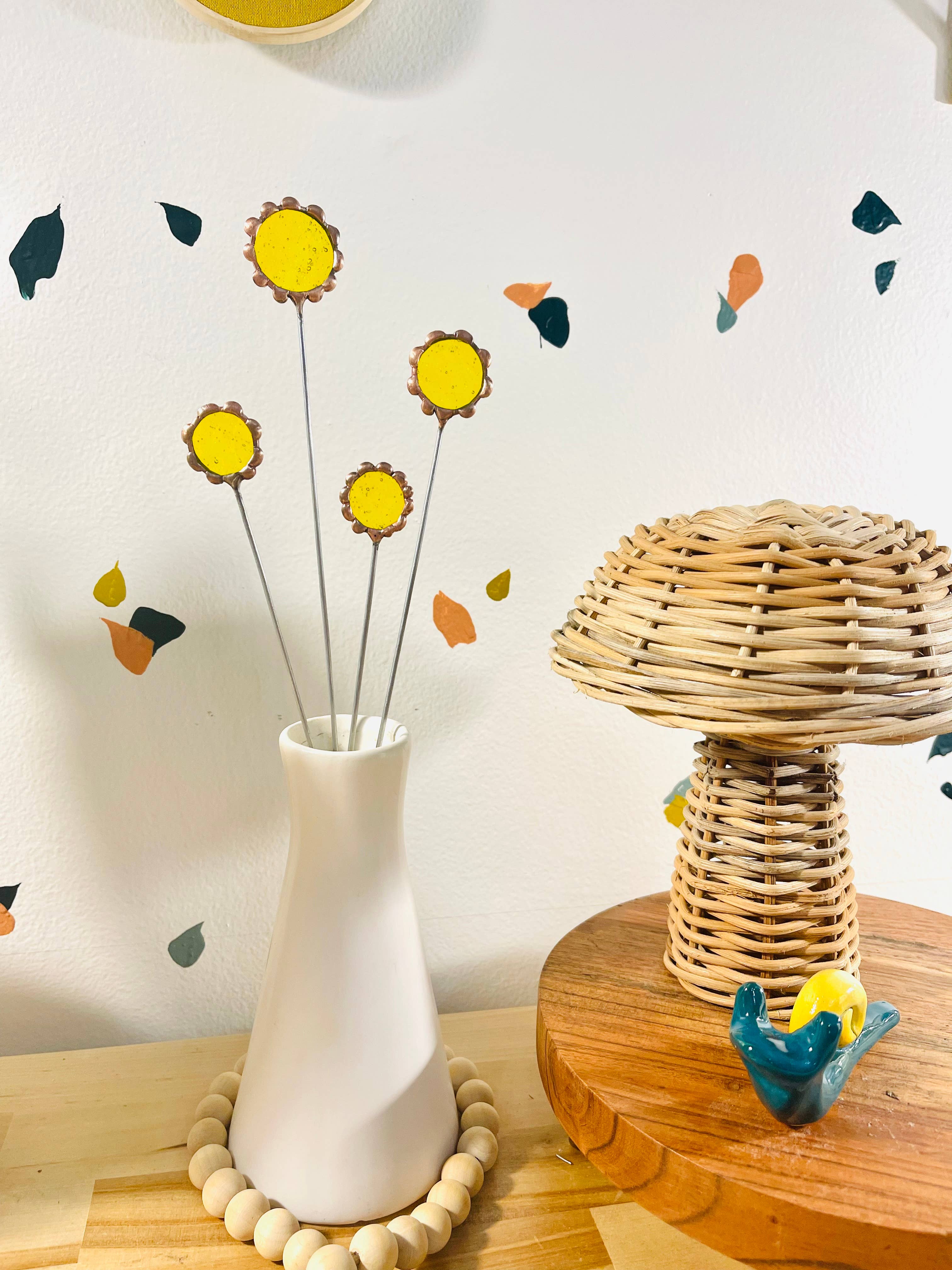 Handmade stained glass buttercups add bright yellow charm to any space. Pet-safe, low-maintenance decor for vases or planters. Set of four stems.