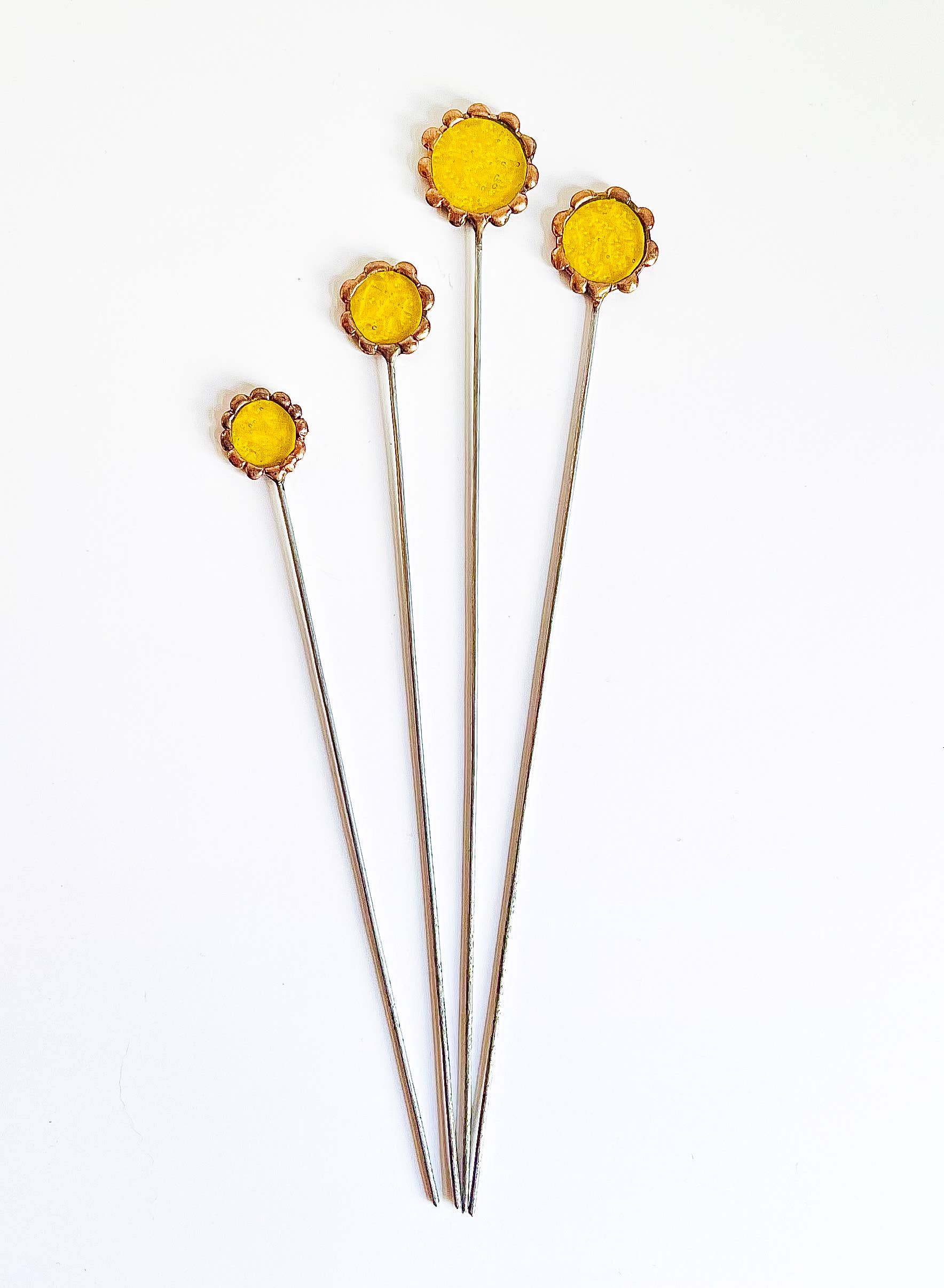 Handmade stained glass buttercups add bright yellow charm to any space. Pet-safe, low-maintenance decor for vases or planters. Set of four stems.