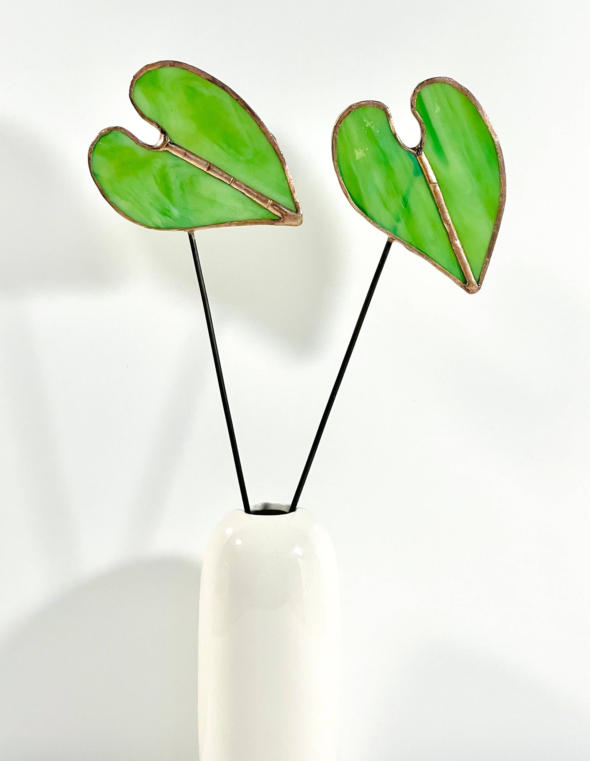 Bring a pop of color and artistry to your home with this handcrafted stained glass elephant ear by Samara Designs Studio. Each piece is made by hand using carefully selected stained glass, cut and assembled with care to create a lasting botanical accent that will never wilt or fade.