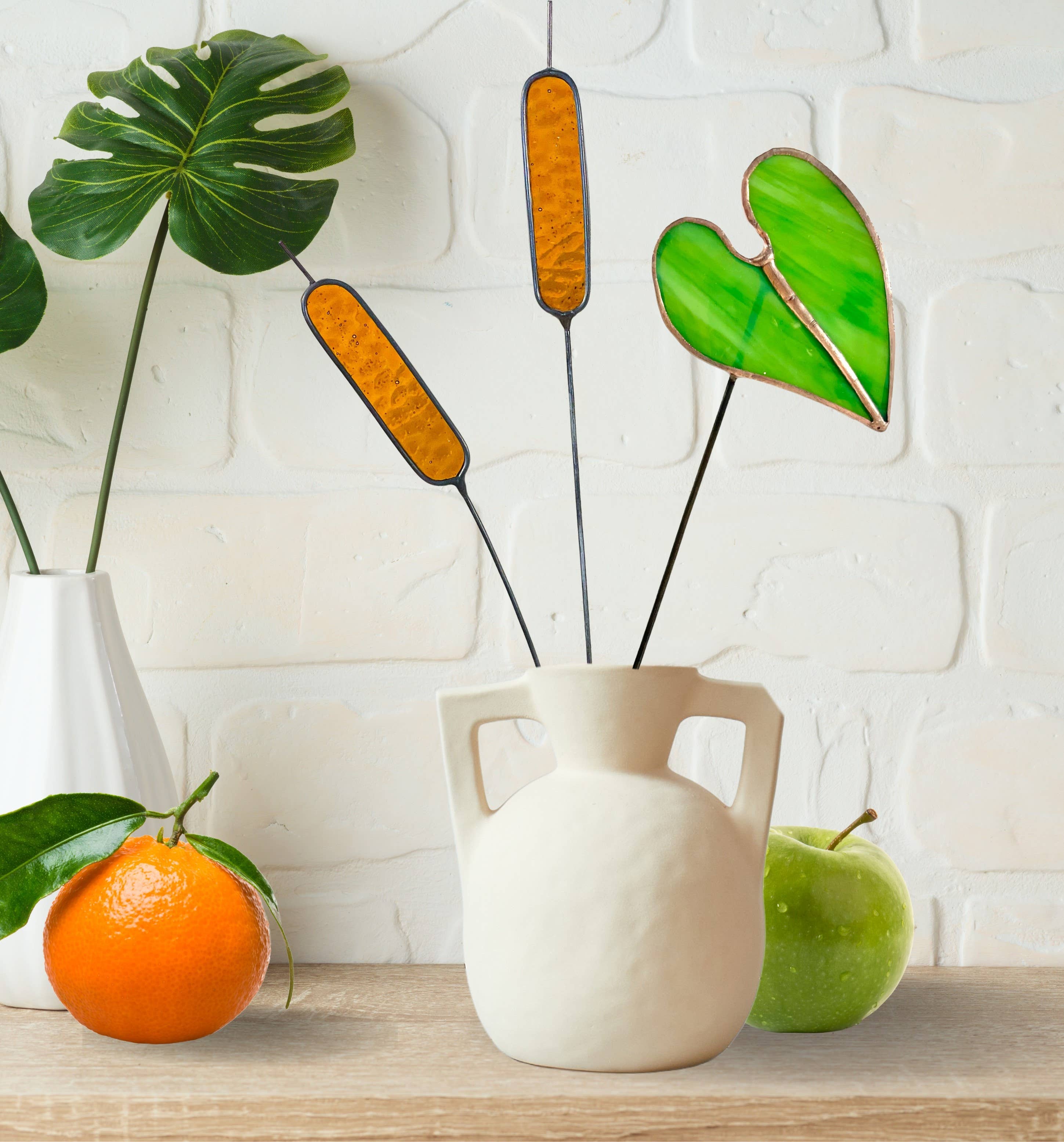 Bring a pop of color and artistry to your home with this handcrafted stained glass elephant ear by Samara Designs Studio. Each piece is made by hand using carefully selected stained glass, cut and assembled with care to create a lasting botanical accent that will never wilt or fade.