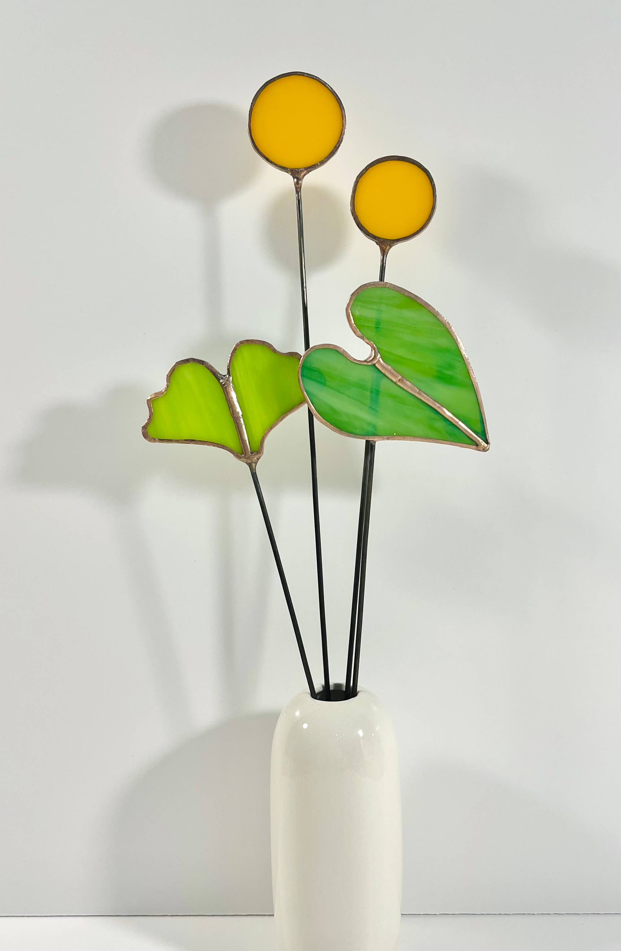 Bring a pop of color and artistry to your home with this handcrafted stained glass elephant ear by Samara Designs Studio. Each piece is made by hand using carefully selected stained glass, cut and assembled with care to create a lasting botanical accent that will never wilt or fade.