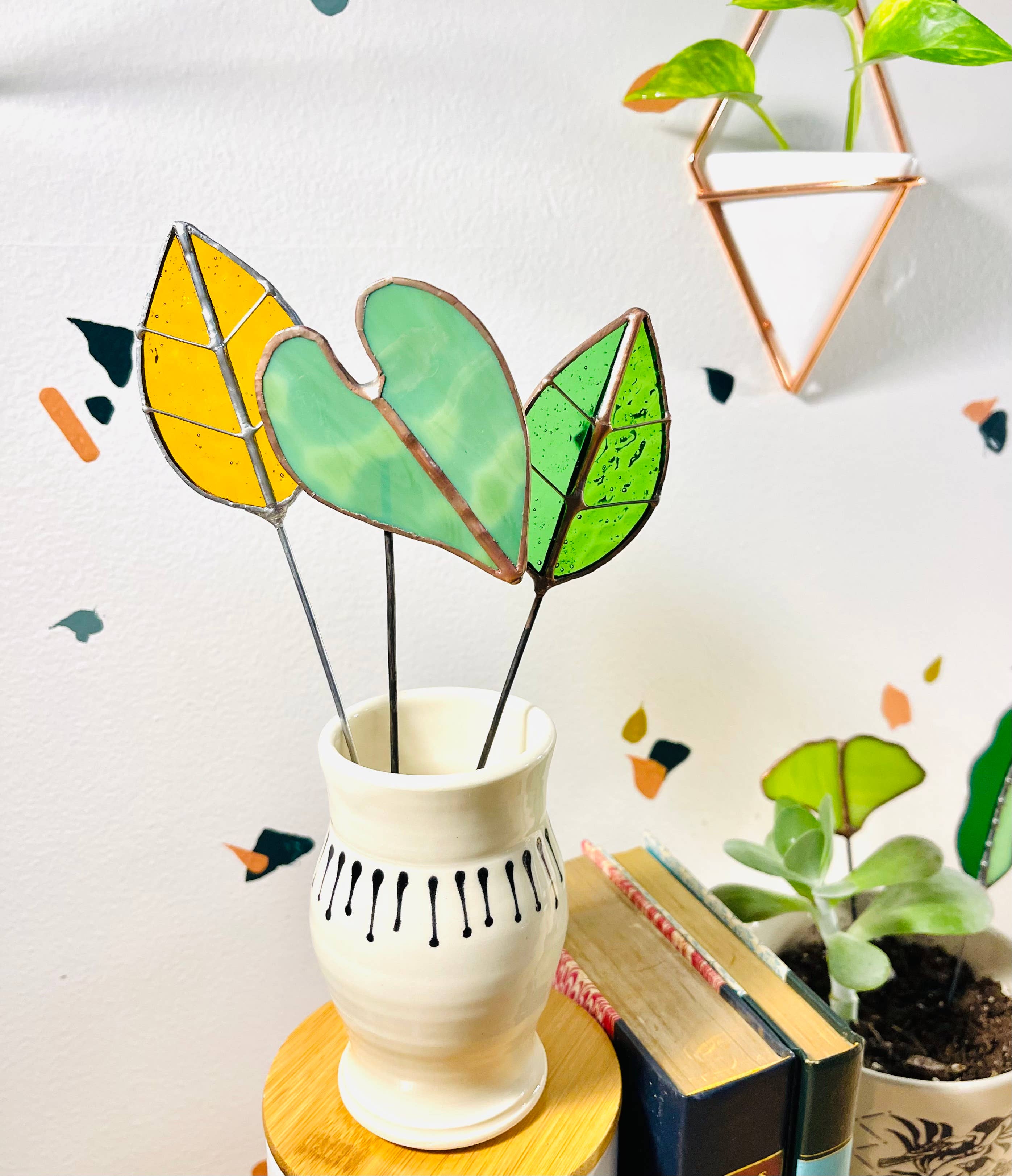 Bring a pop of color and artistry to your home with this handcrafted stained glass elephant ear by Samara Designs Studio. Each piece is made by hand using carefully selected stained glass, cut and assembled with care to create a lasting botanical accent that will never wilt or fade.