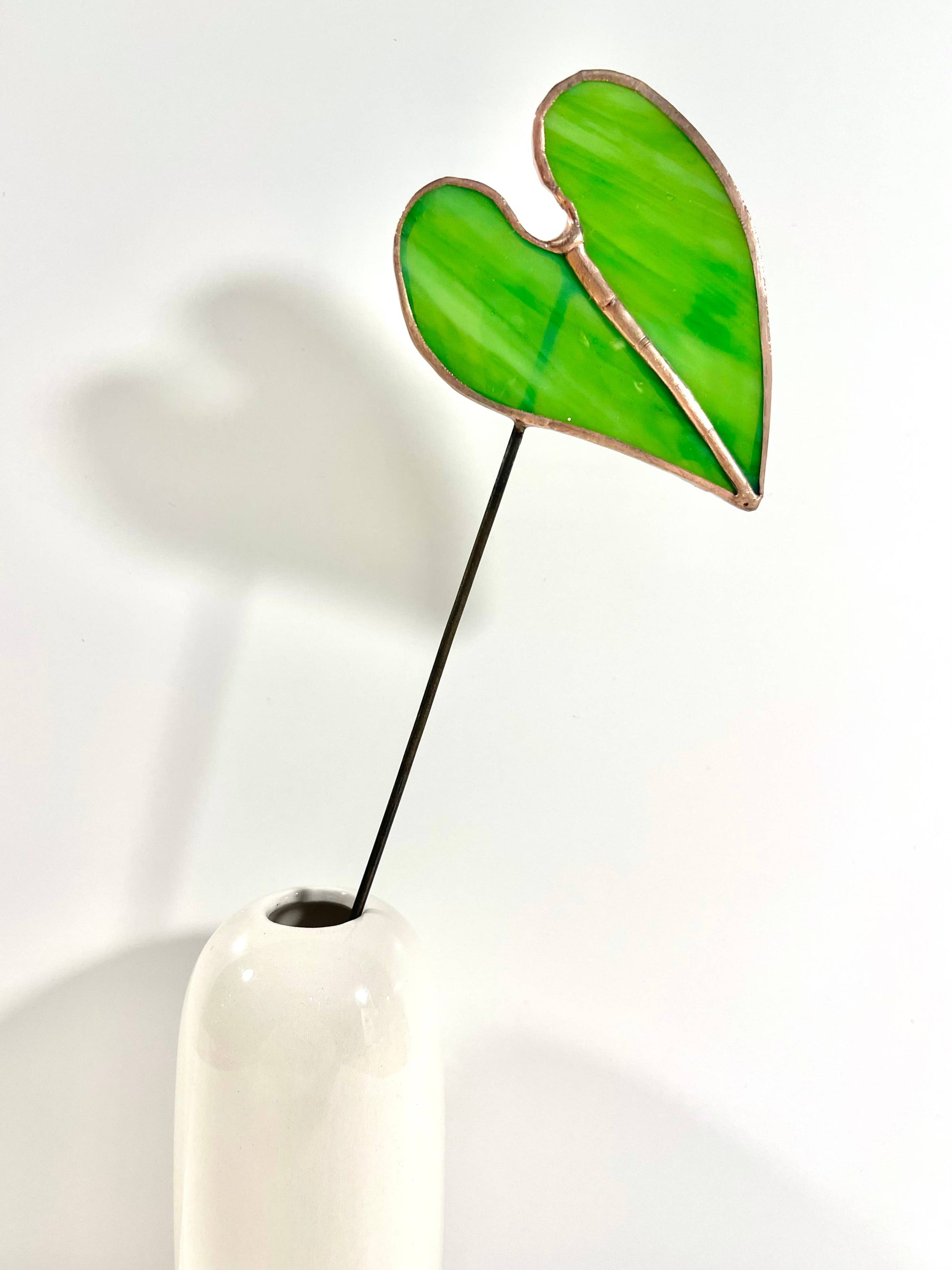 Bring a pop of color and artistry to your home with this handcrafted stained glass elephant ear by Samara Designs Studio. Each piece is made by hand using carefully selected stained glass, cut and assembled with care to create a lasting botanical accent that will never wilt or fade.