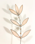 Bring a pop of color and artistry to your home with this handcrafted stained glass peachy pink wildflower by Samara Designs Studio. This delicate sprig is handmade using peachy pink stained glass. Each piece of glass is hand cut and meticulously crafted using the traditional stained glass copper foil technique to create a lasting botanical accent that will never wilt or fade.