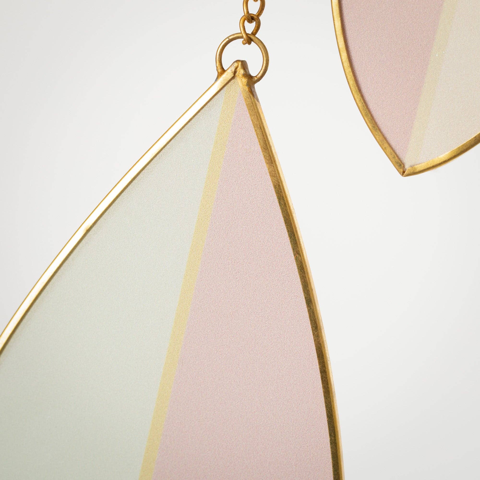 Brighten any room with this pink & green stained glass suncatcher with copper accents—elegant, modern, and perfect as a gift.