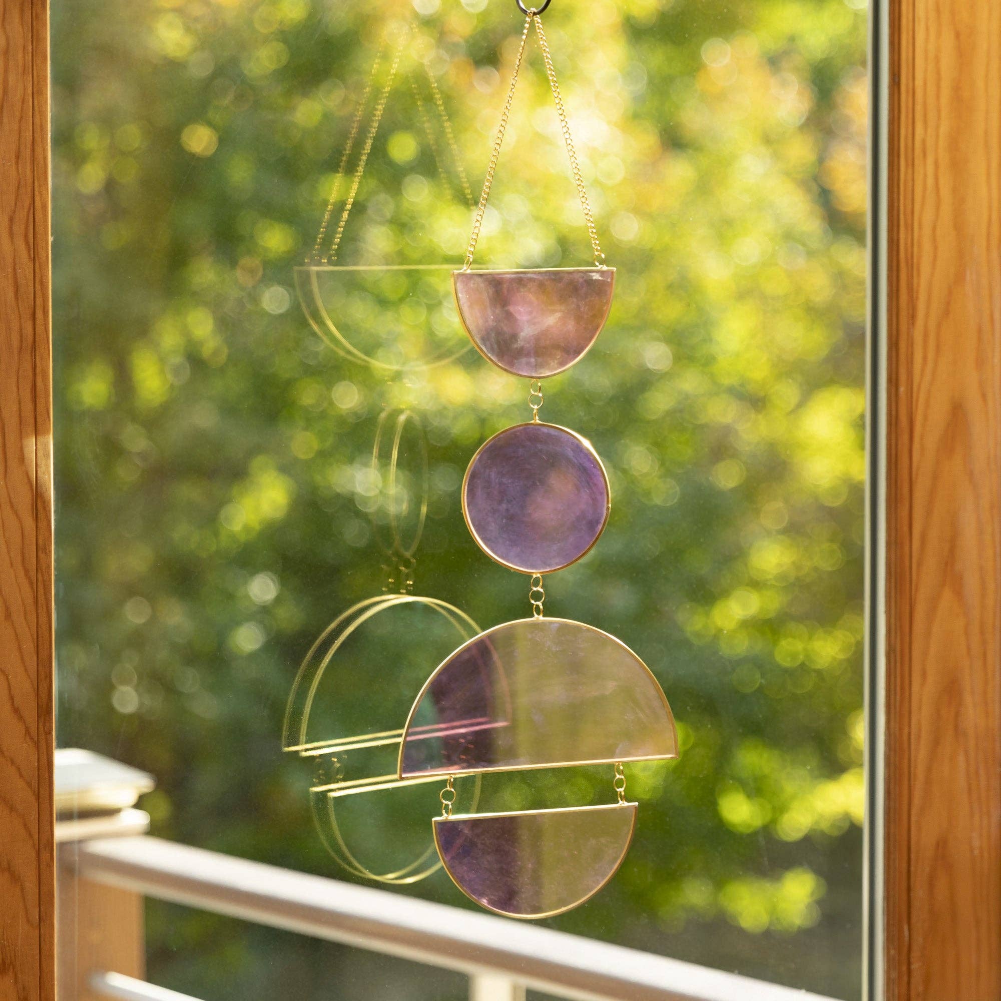 Catch sunlight in a brilliant prismatic display with this rainbow suncatcher—stained glass, gold accents, and vibrant, ever-changing colors.