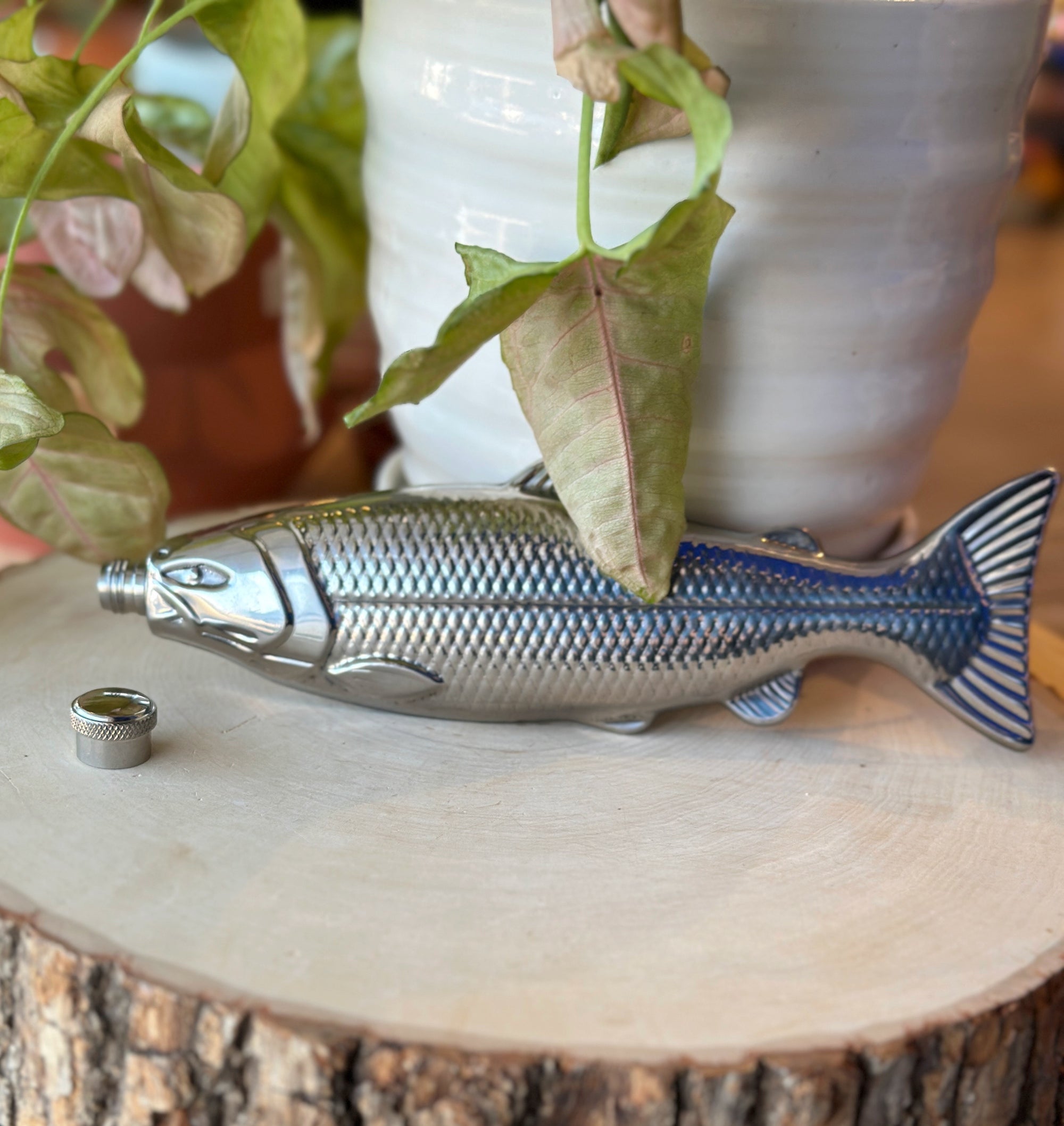 Sleek silver fish flask—stainless steel, pocket-friendly, and perfect for on-the-go pours. Polished, portable, and ready to make a splash.