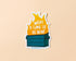 Sticker with a dumpster fire graphic and text 'What a time to be alive' on a beige background