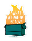 Sticker with a dumpster fire graphic and text 'What a time to be alive' on a white background.