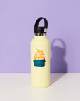 Yellow water bottle with a black lid on a white surface against a purple background
