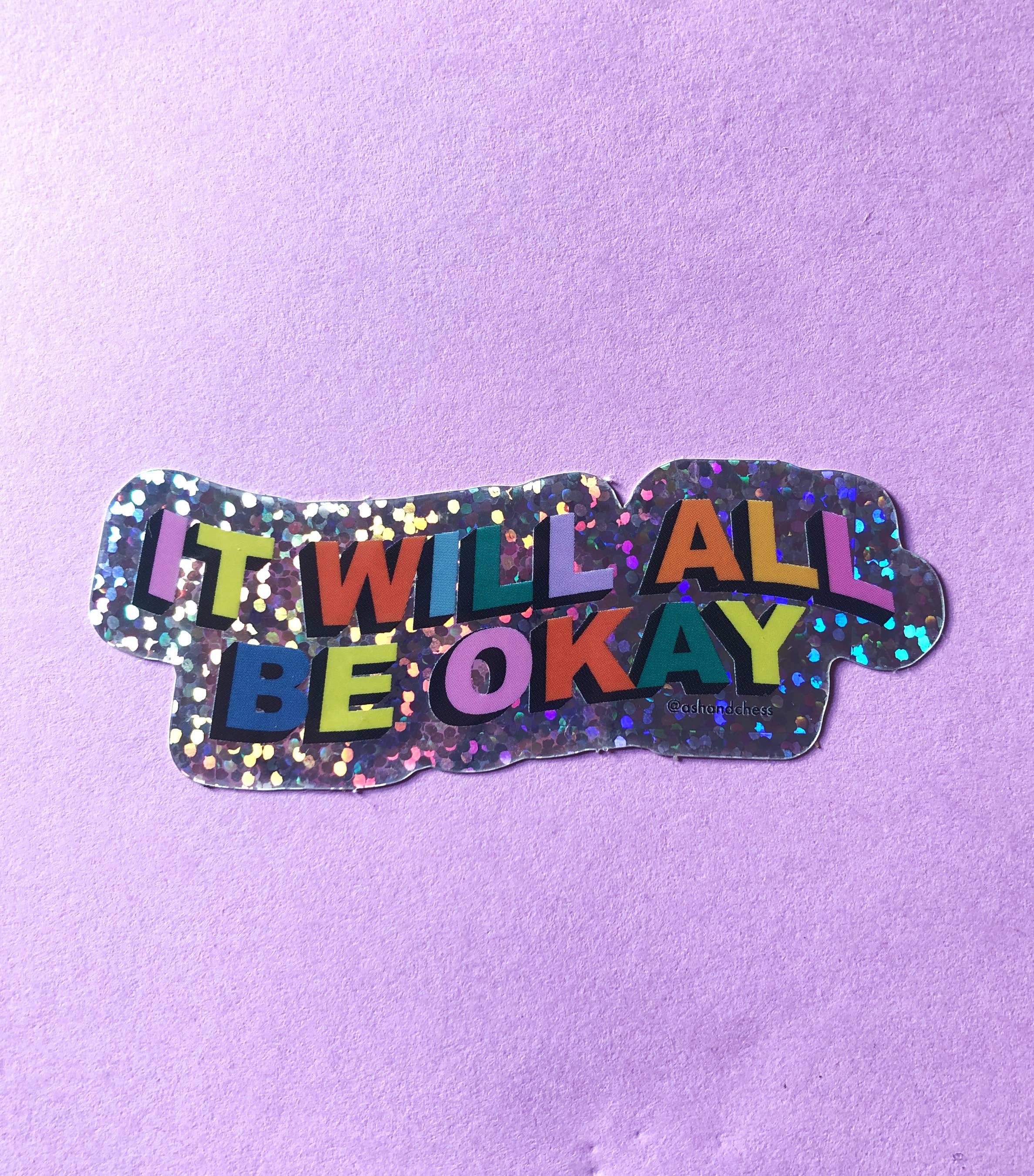 Sticker with 'It will all be okay' text on a purple background