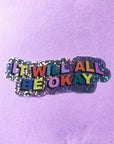 Sticker with 'It will all be okay' text on a purple background