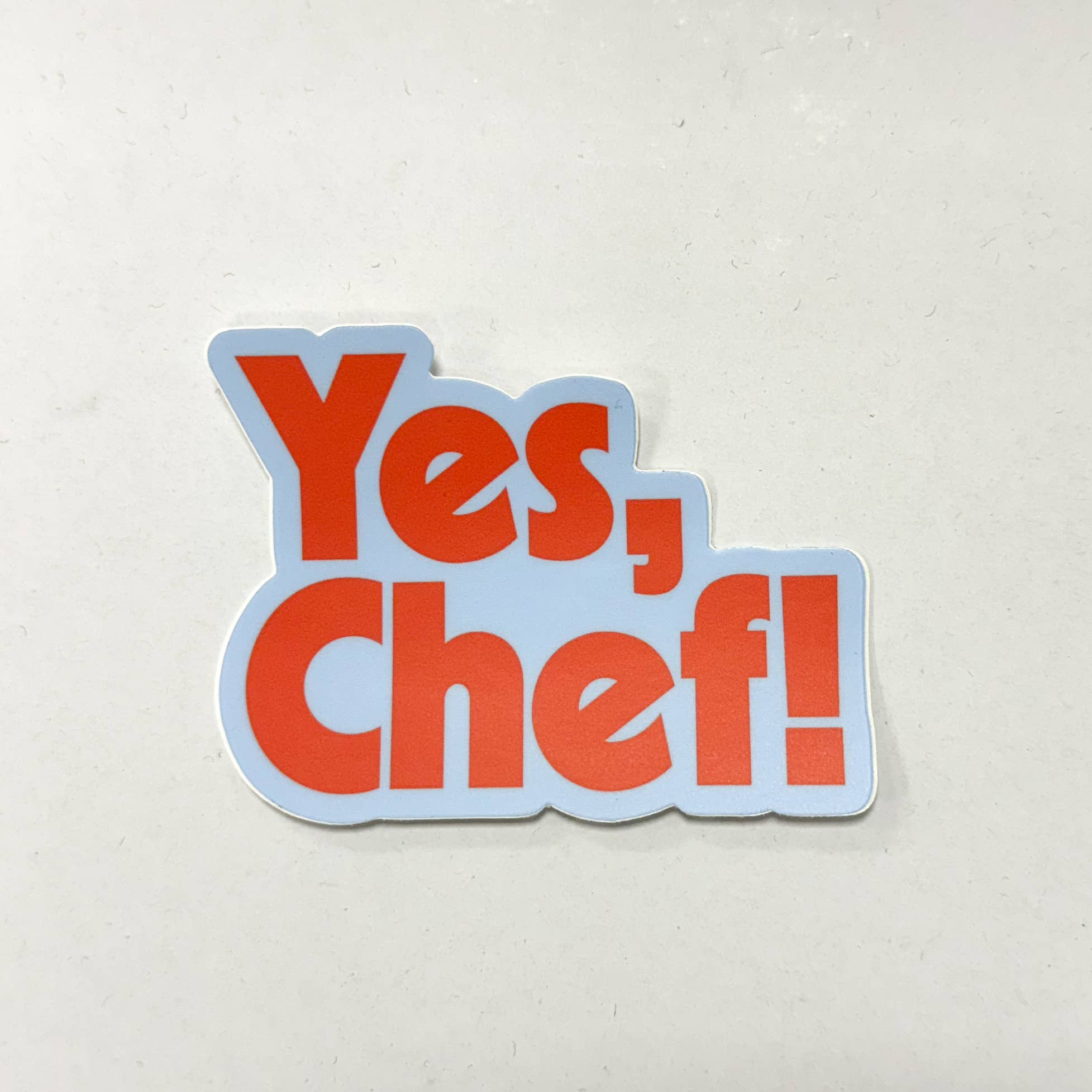 Sticker with 'Yes, Chef!' text on a light gray background
