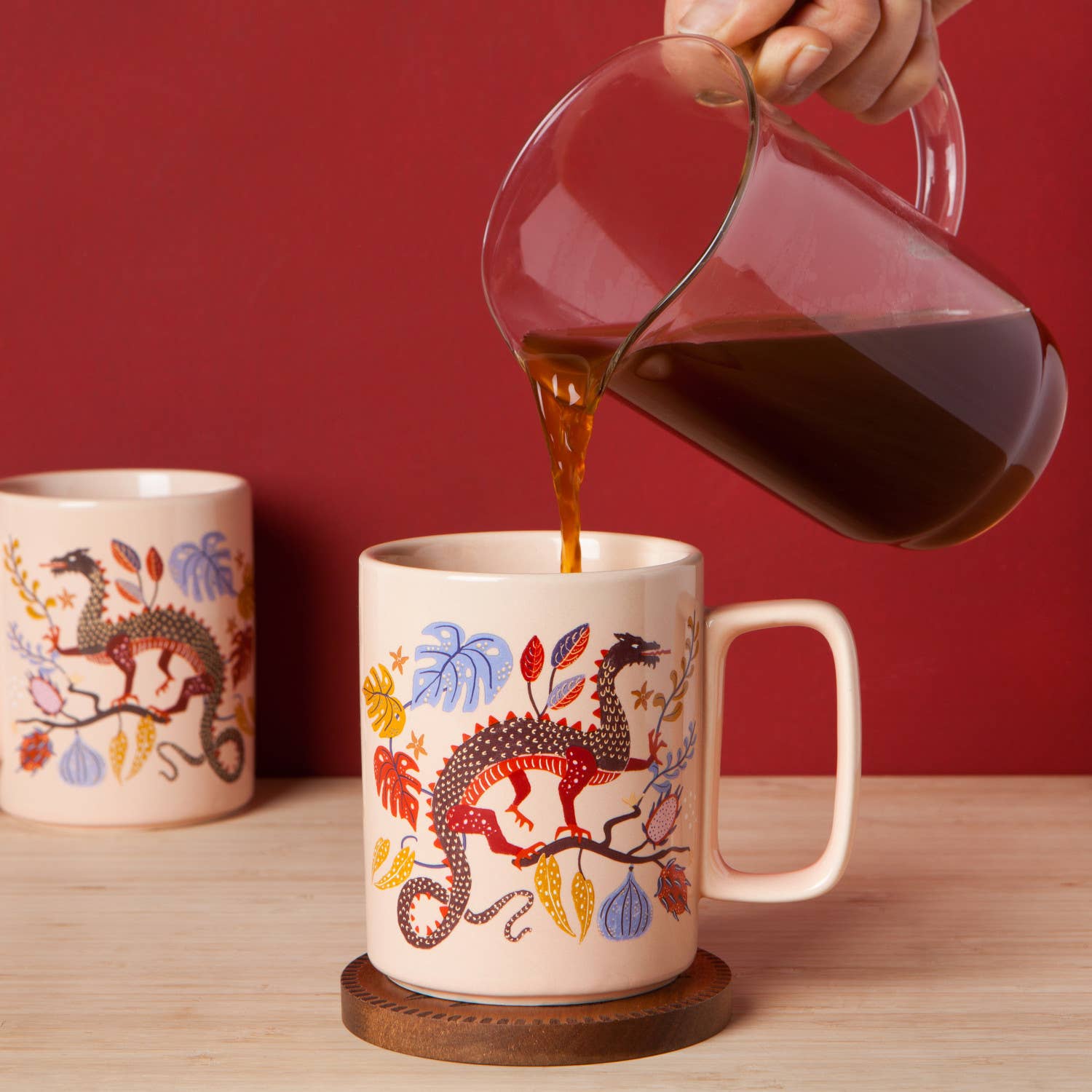 Start your day with a touch of mythical charm with the Ember Stoneware Mug. Adorned with a fierce, fire-breathing dragon, it embodies strength, adventure, and timeless ambition.