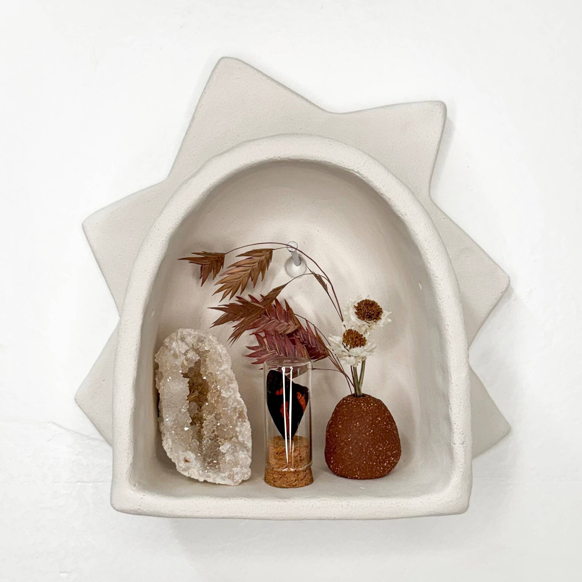 Handmade Sun Arch curio shelf by The Minimalist Ceramist. Perfect for displaying crystals, rocks, air plants, pinecones, and nature-inspired treasures.