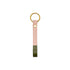 Natural leather key fob with an olive painted tip and brass ring on a white background