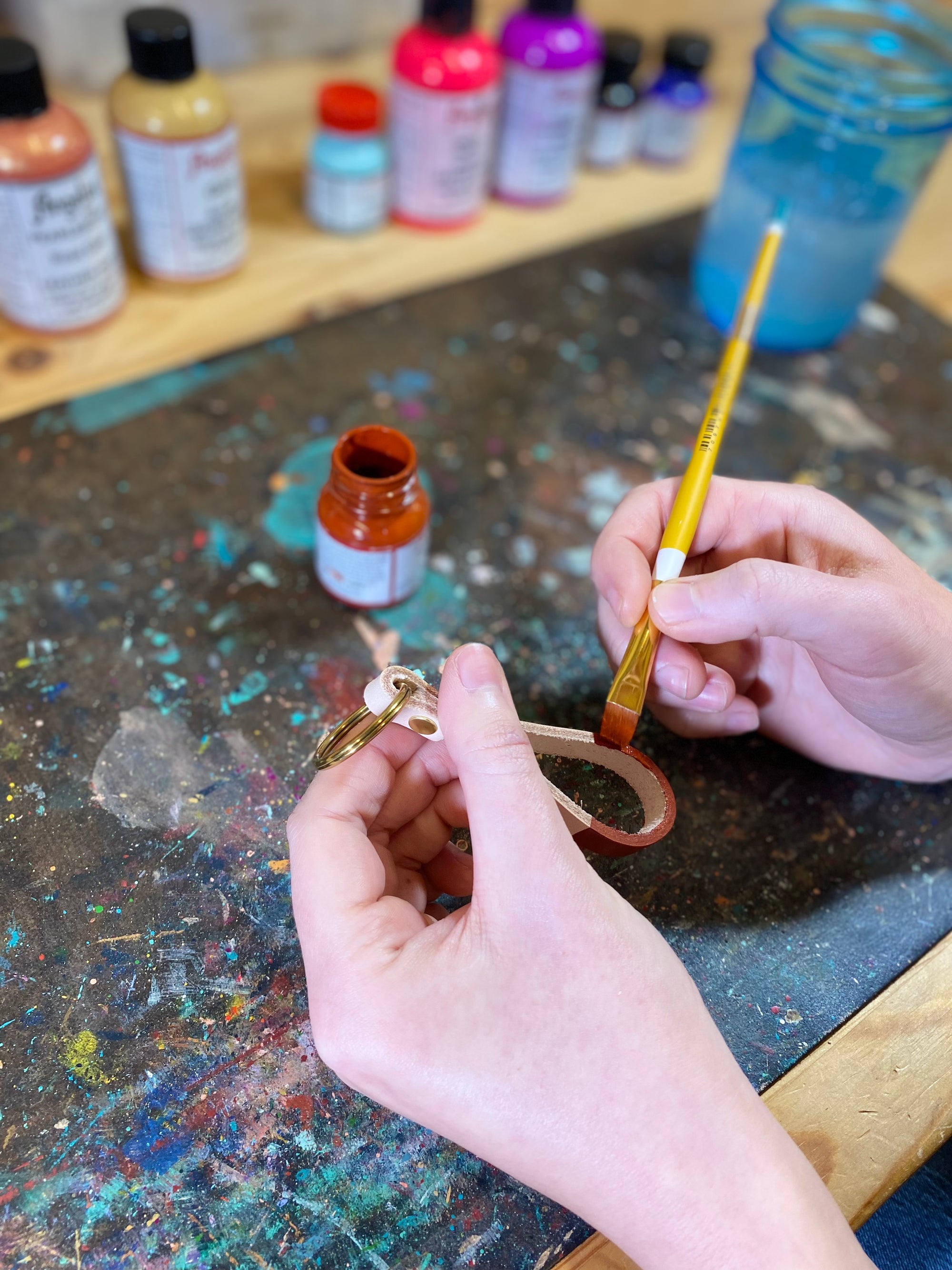 Hand-painted in bold accent colors on genuine leather and is the optimal size for carrying your keys in style. This key fob has a solid rivet and key ring of your choice, and features up to three hand-tooled initials! Hand-painted in bold accent colors on natural veg-tanned leather, this key fob has a solid brass rivet and split ring, and is the optimal size for carrying your keys in style. Available in your choice of any of our custom colors.