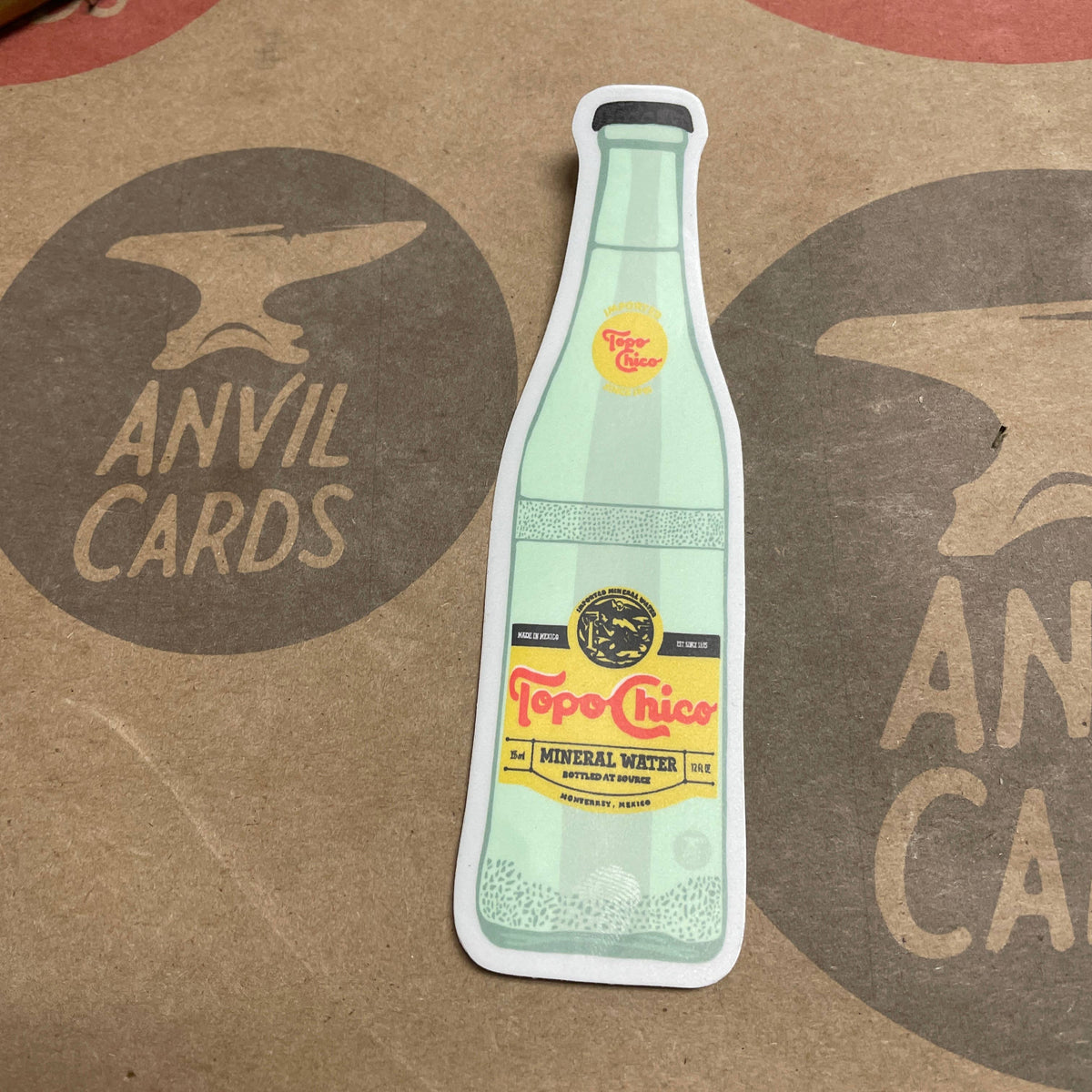Show your love for the fizzy stuff with this Topo Chico bottle sticker! Made from super durable vinyl, this sticker is tough enough for your car, water bottle, laptop, cooler—wherever you need a little extra personality. Weatherproof, waterproof, and ready for adventure, it’s guaranteed to stick through whatever you throw its way.