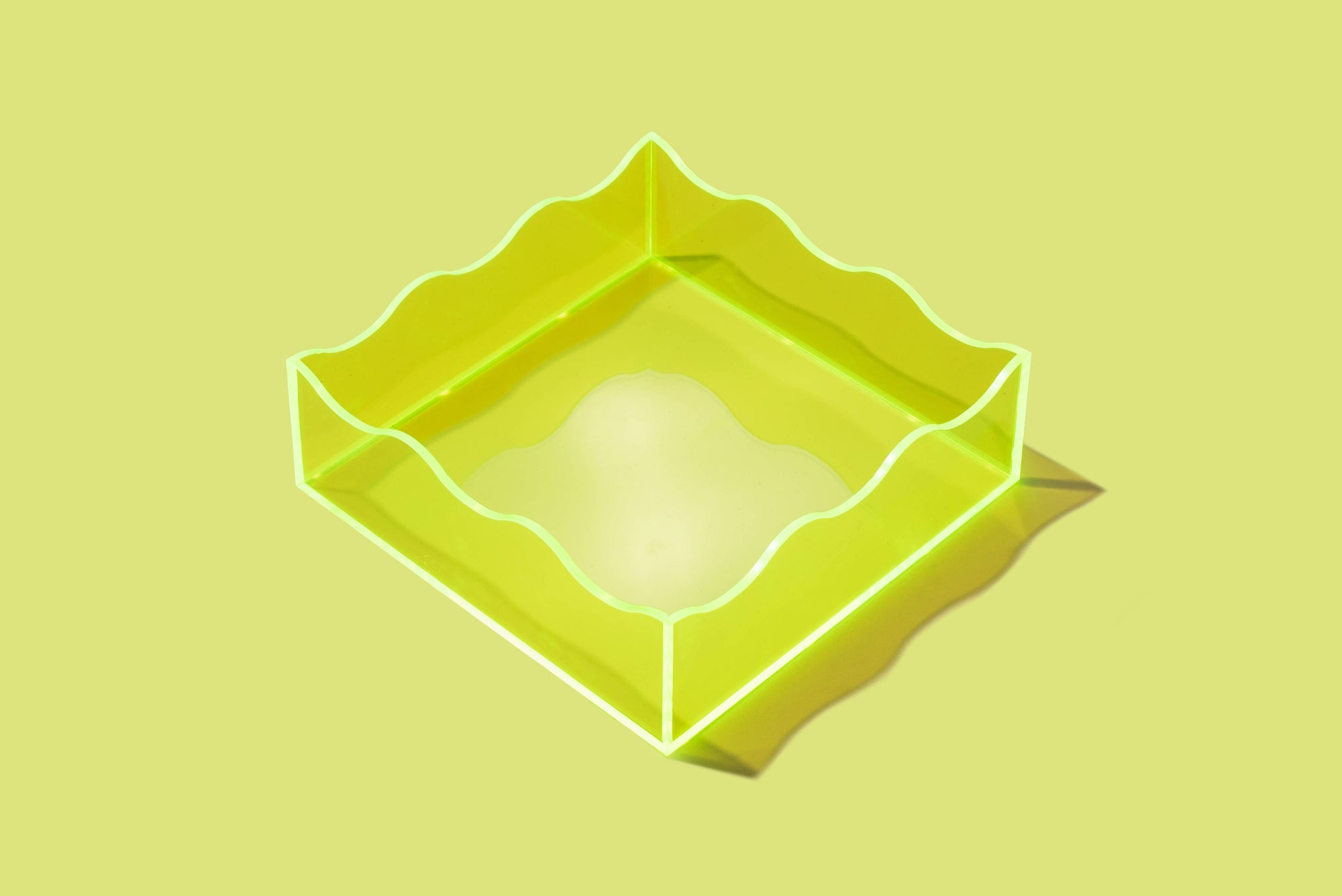 Bring a bold pop of color to your space with this neon green acrylic tray! Whether you're organizing your desk or styling your vanity, this vibrant tray adds a modern, playful touch. Made from durable acrylic, it’s perfect for both everyday use and eye-catching decor.