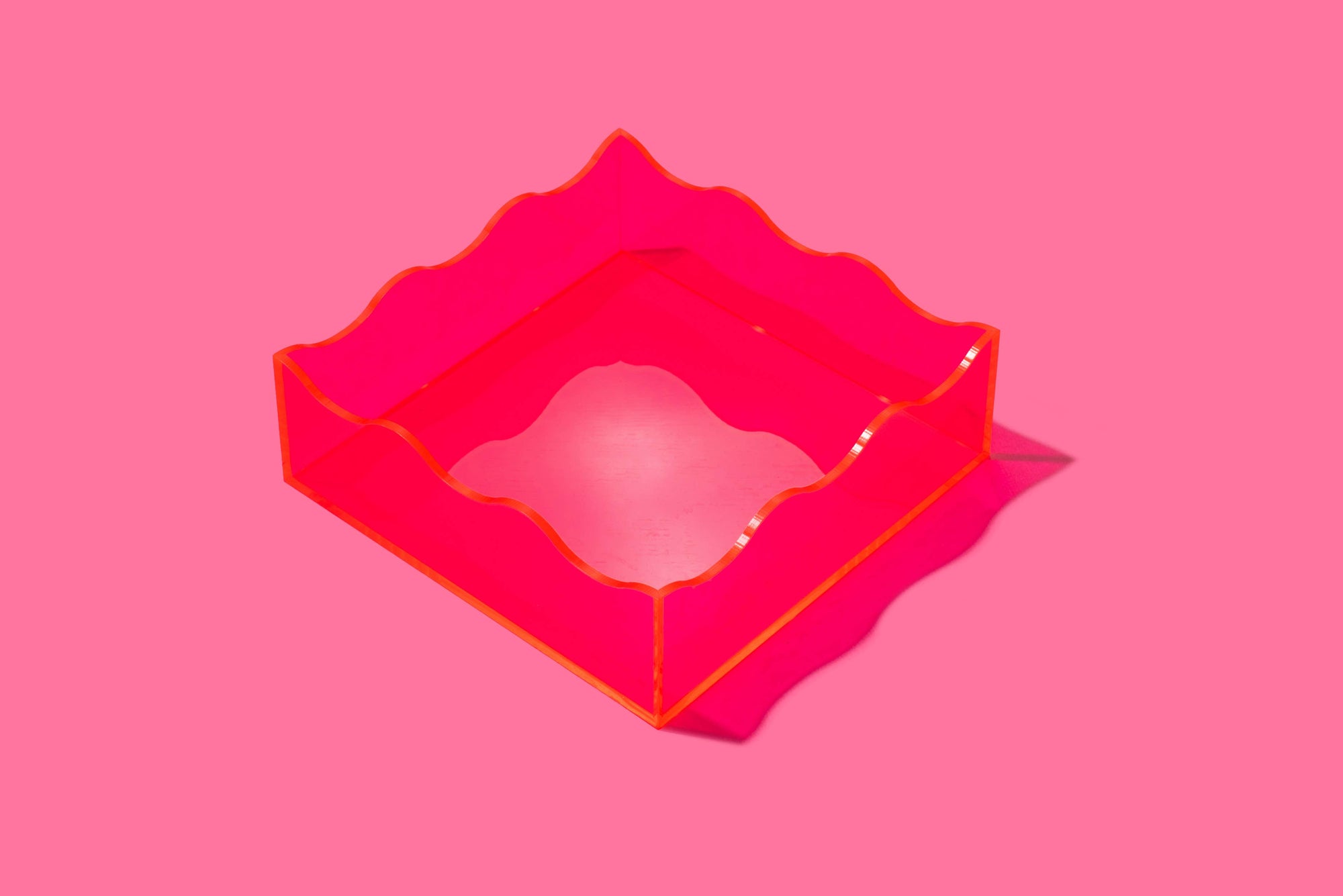 Bring a bold pop of color to your space with this hot pink acrylic tray! Whether you're organizing your desk or styling your vanity, this vibrant tray adds a modern, playful touch. Made from durable acrylic, it’s perfect for both everyday use and eye-catching decor.